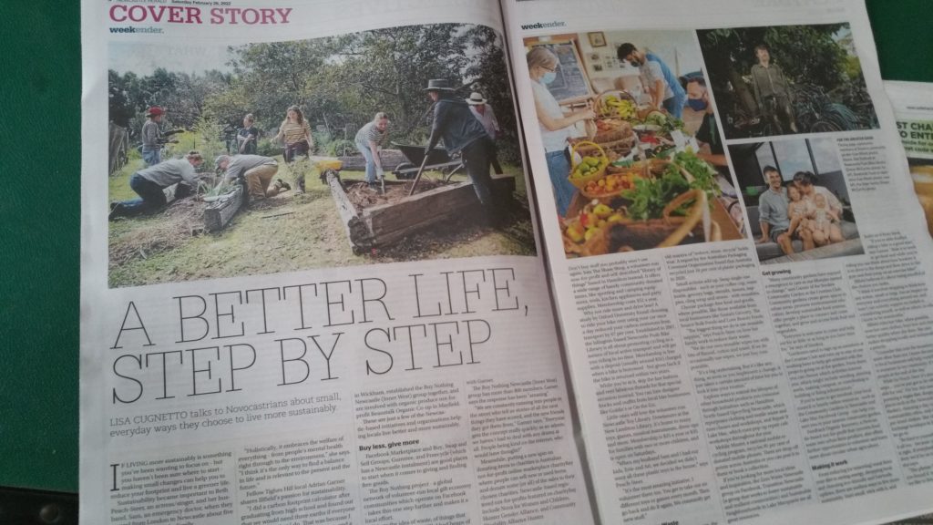 Newspaper with headline "a better life, step by step". Pictures of a community garden, a food co-op, bike repair man and a family. 